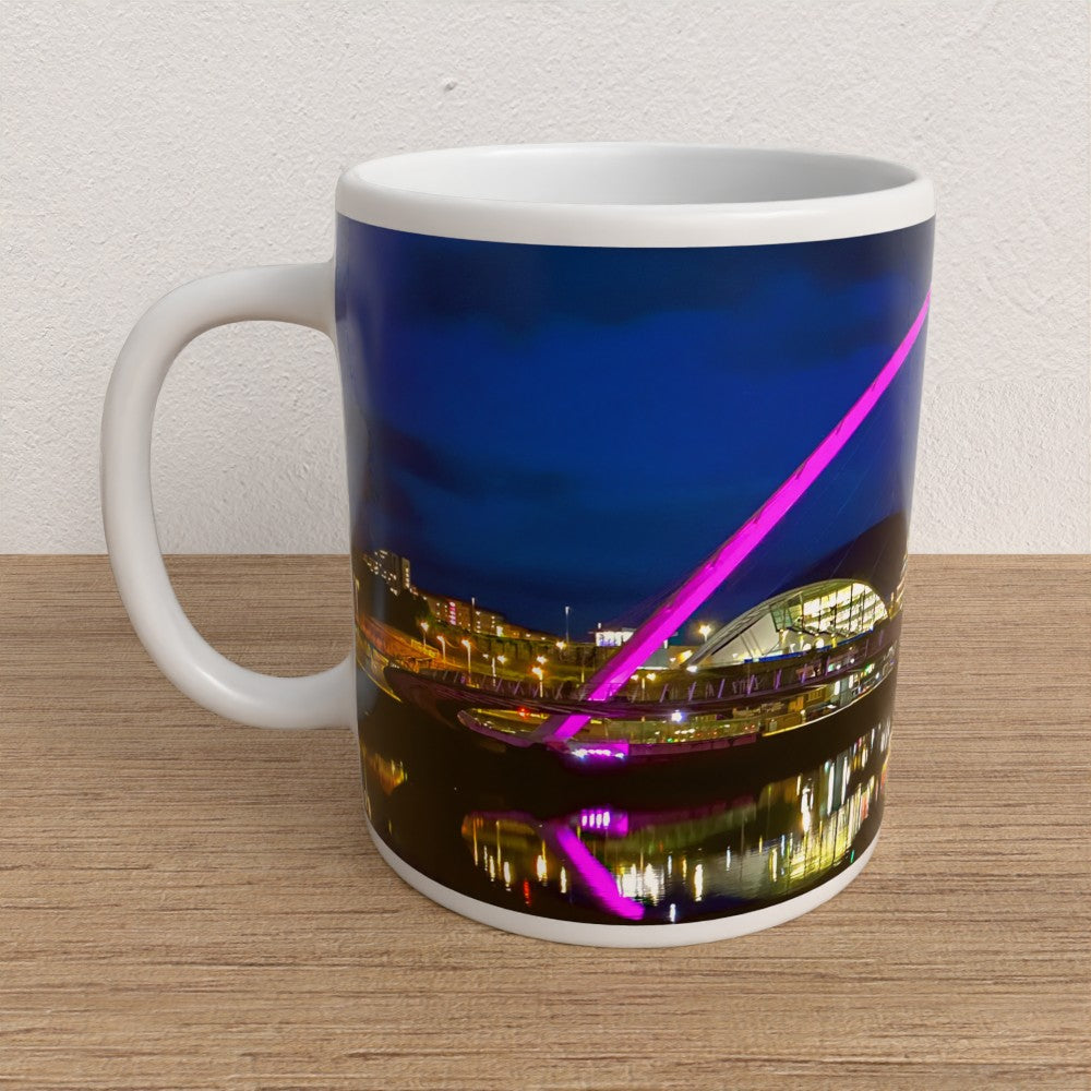 Mug with a cityscape design featuring lights on a wooden surface