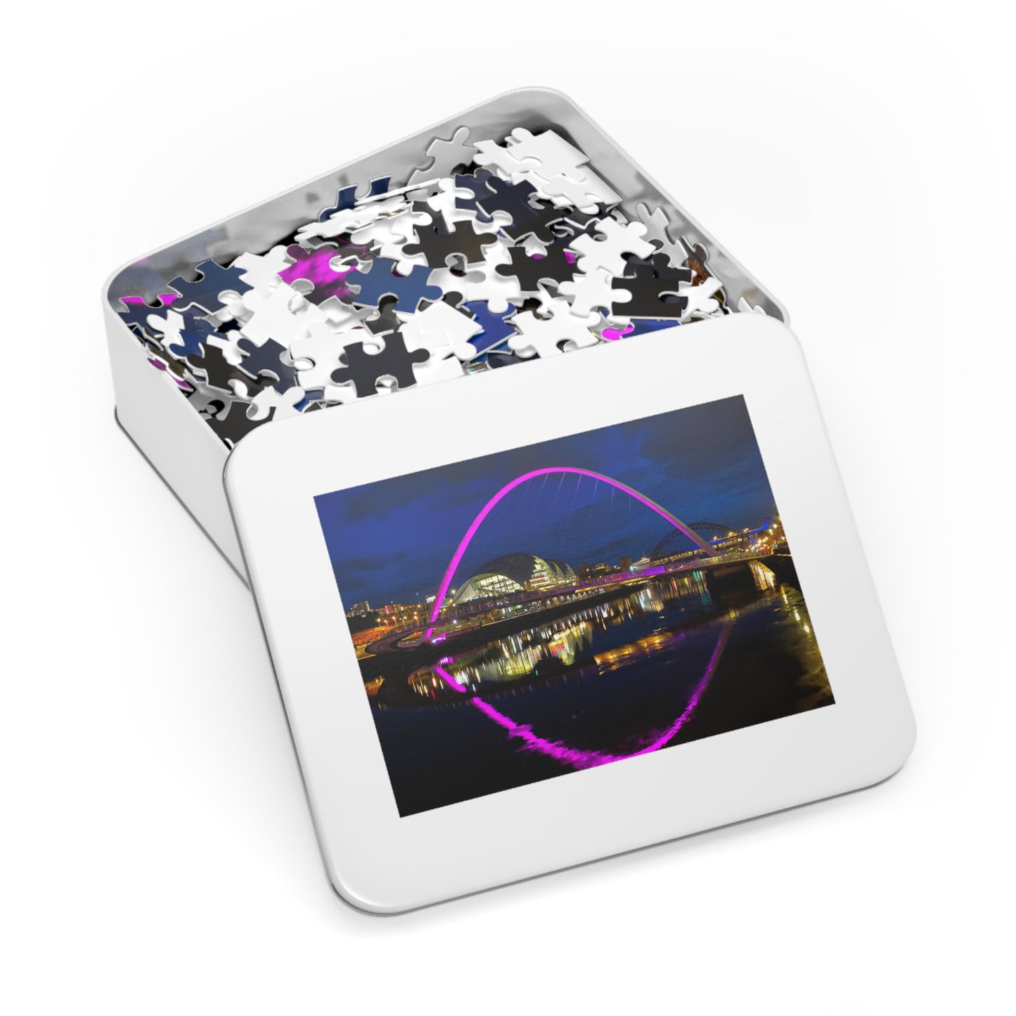 Jigsaw puzzle in a tin with a picture of a bridge on the cover