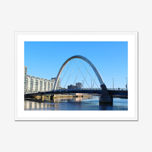 Framed photograph of a cityscape with a bridge over water.