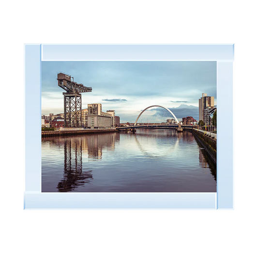 Silver mirror framed picture of a Glasgow landscape overlooking the River Clyde. In the picture you can see famous landmarks like the Clyde Arc Bridge and the Finnieston Crane.