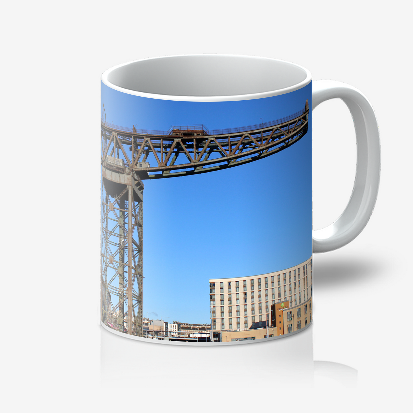 Mug with a design of a bridge and building on a blue sky background