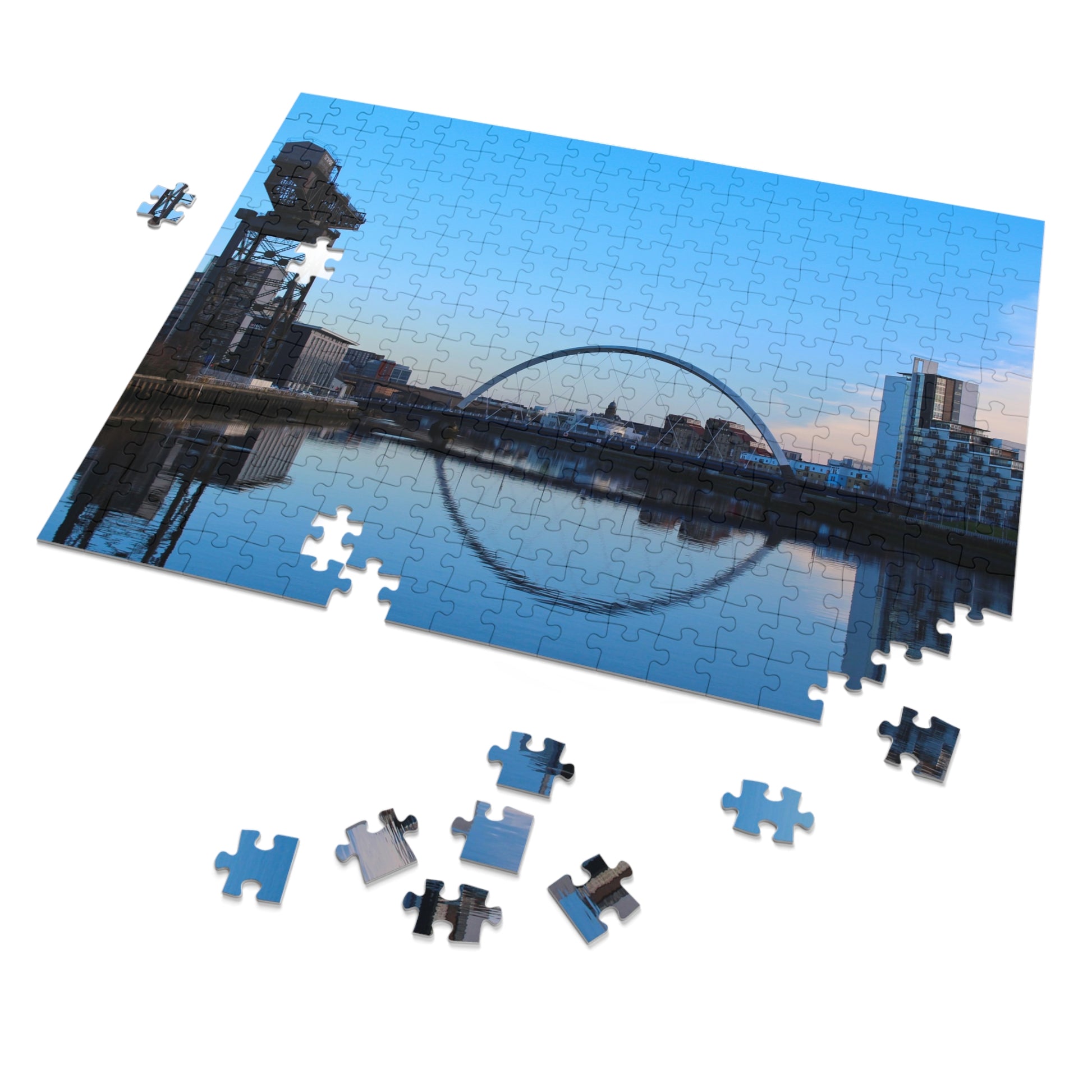 Jigsaw puzzle with a completed section showing a city skyline with a distinctive arch.