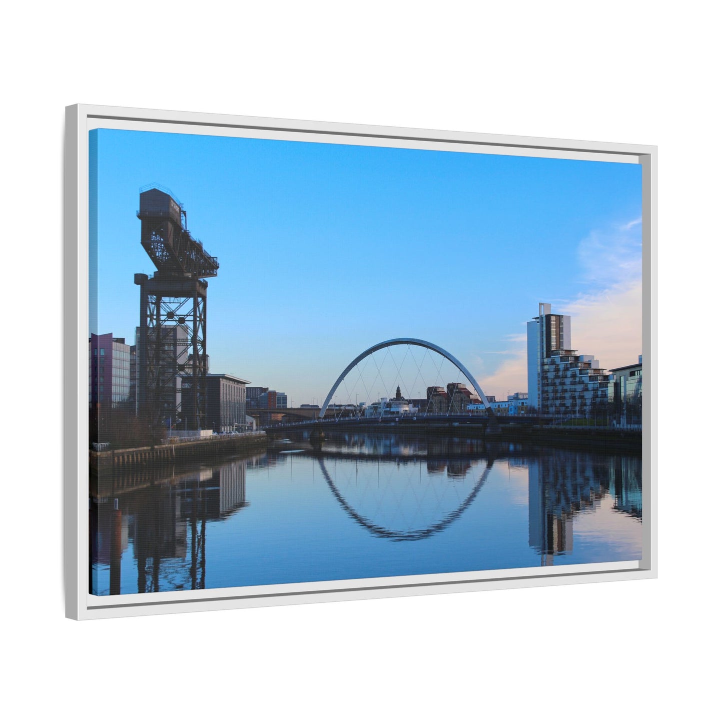 Cityscape with a crane and arch reflected in water, framed as a picture.