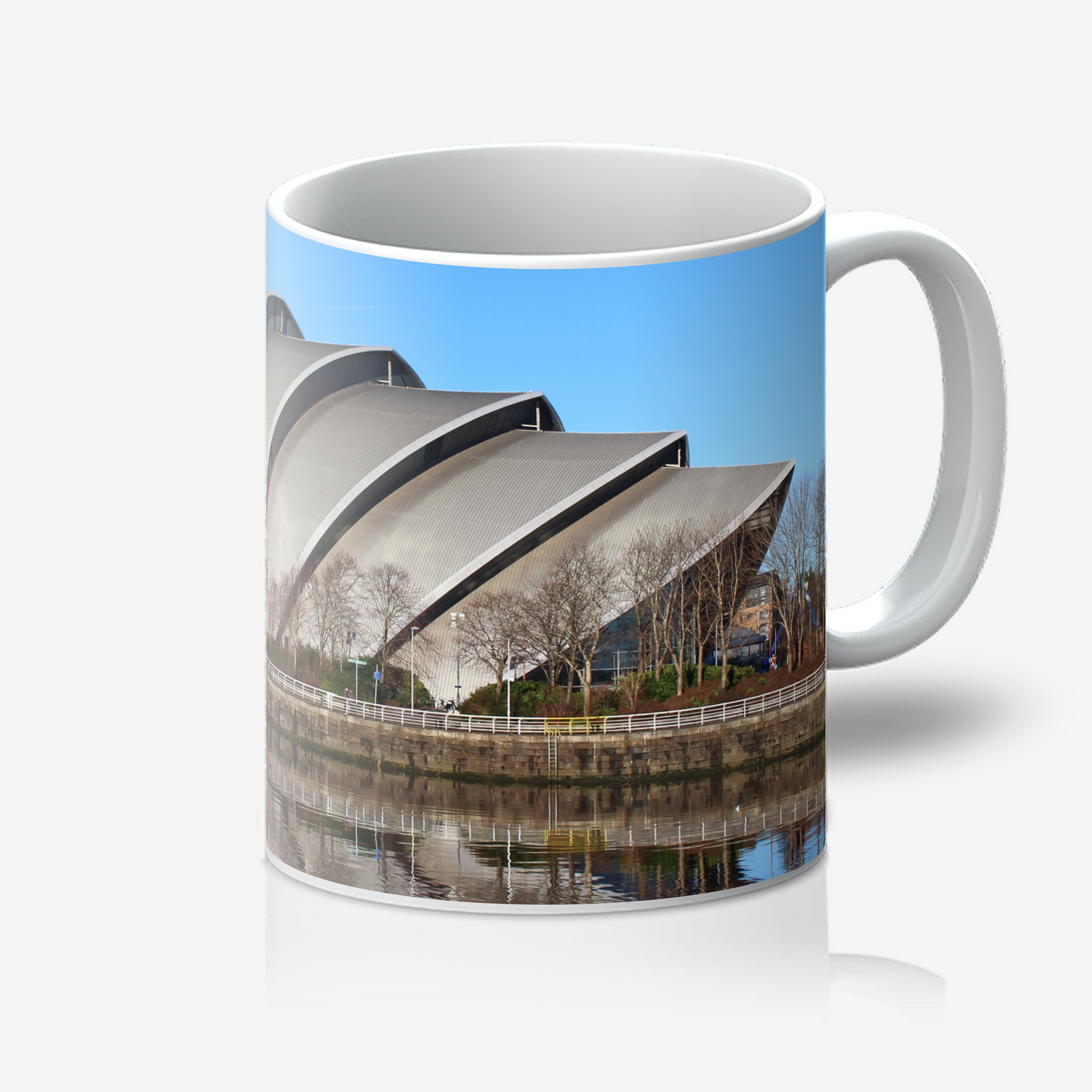 Mug with a design of a modern building and blue sky on a white background