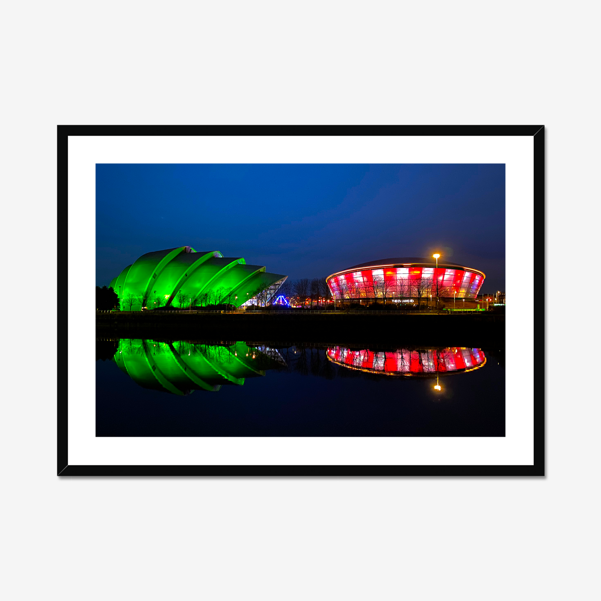 Framed photograph featuring the Glasgow SEC Armadillo and Hydro buildings lit up at night, reflected in the water of the Clyde.