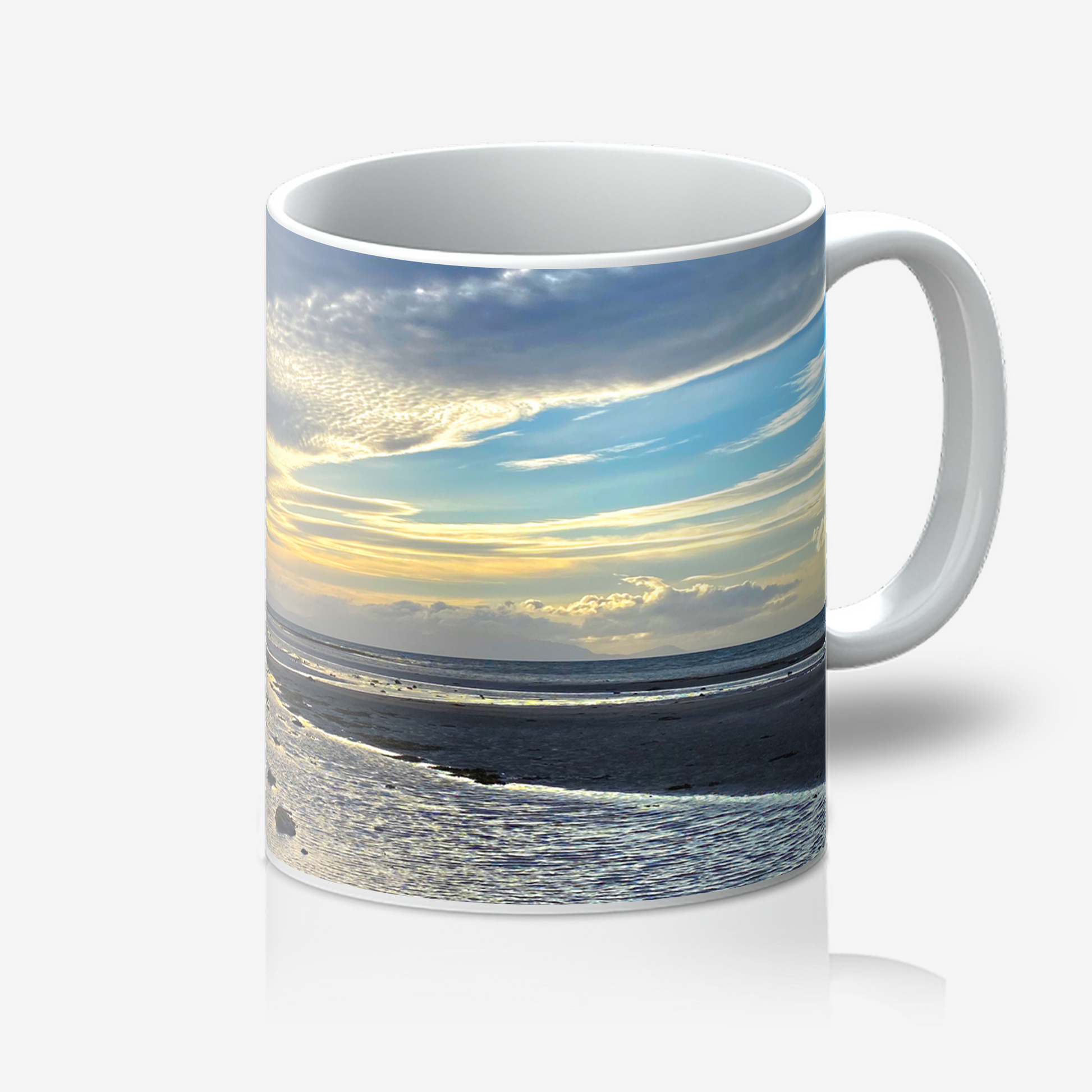Mug with a scenic design of a beach and sky on a white background