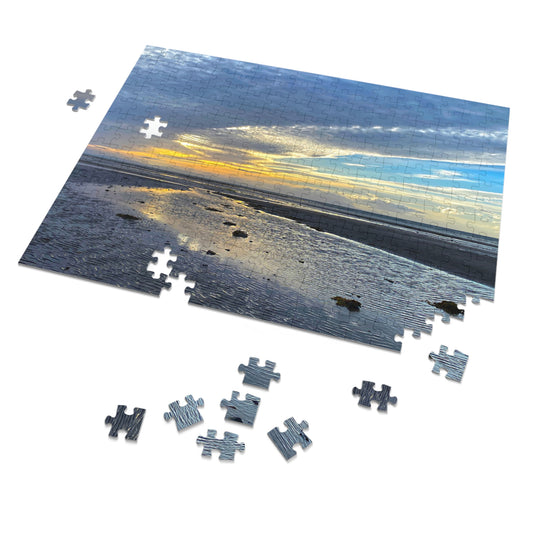 Jigsaw puzzle with a beach scene on a white background