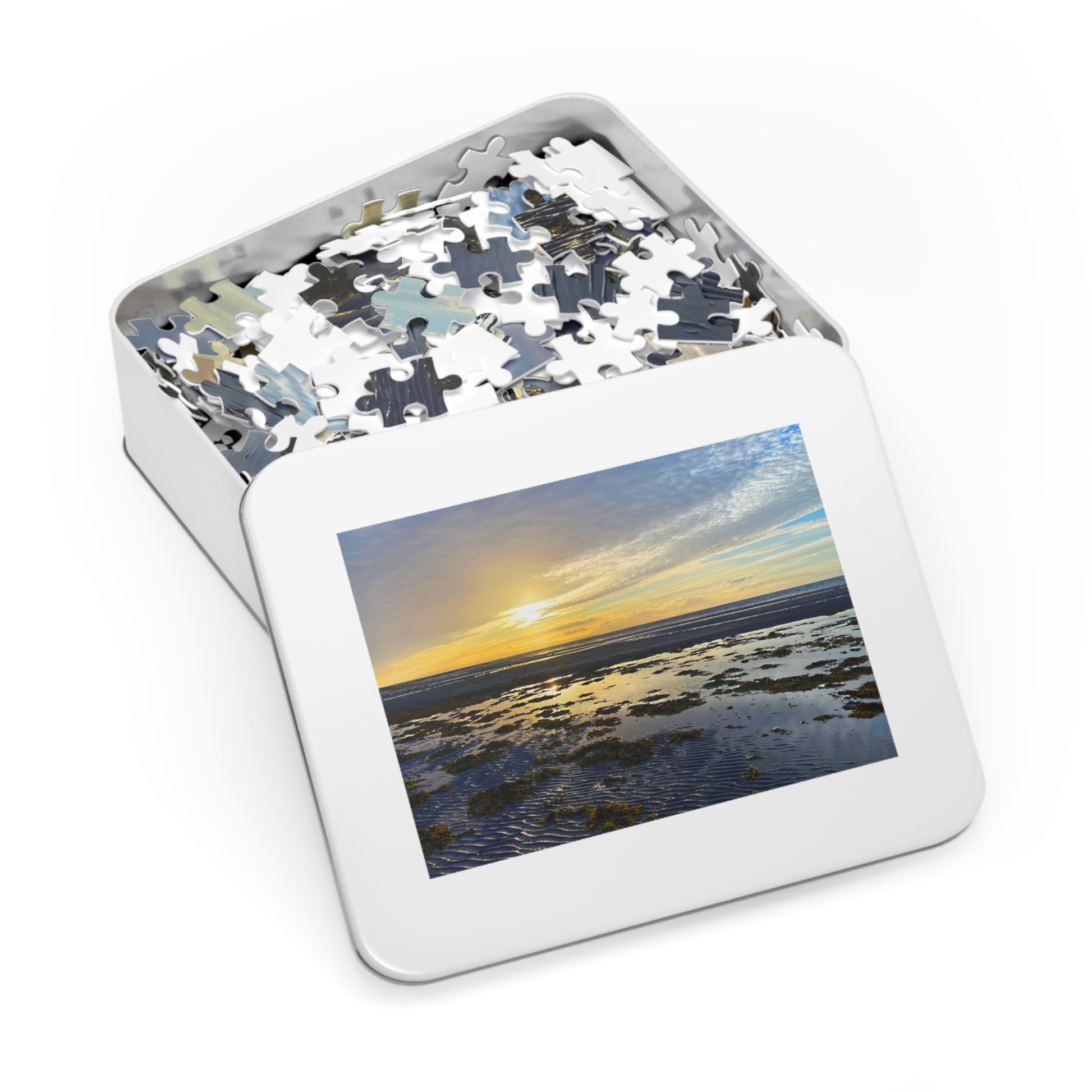 Jigsaw puzzle in a tin with a scenic picture on the lid