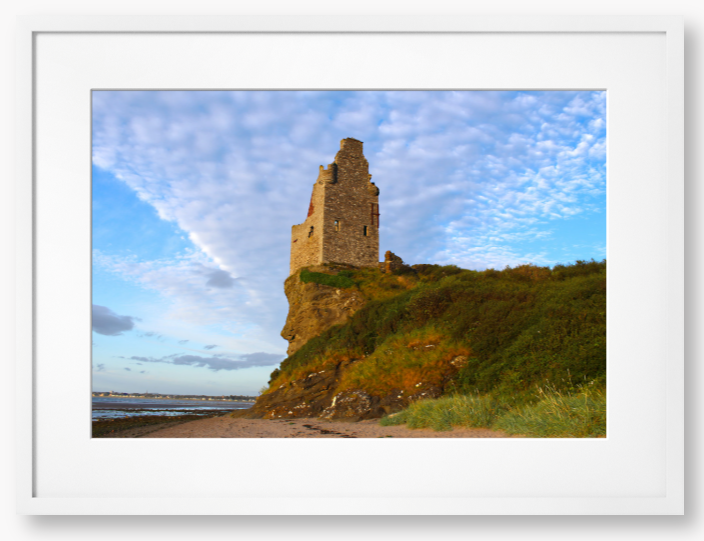 Framed Photo of Ruins of a tower on a cliff with a blue sky and clouds in the background