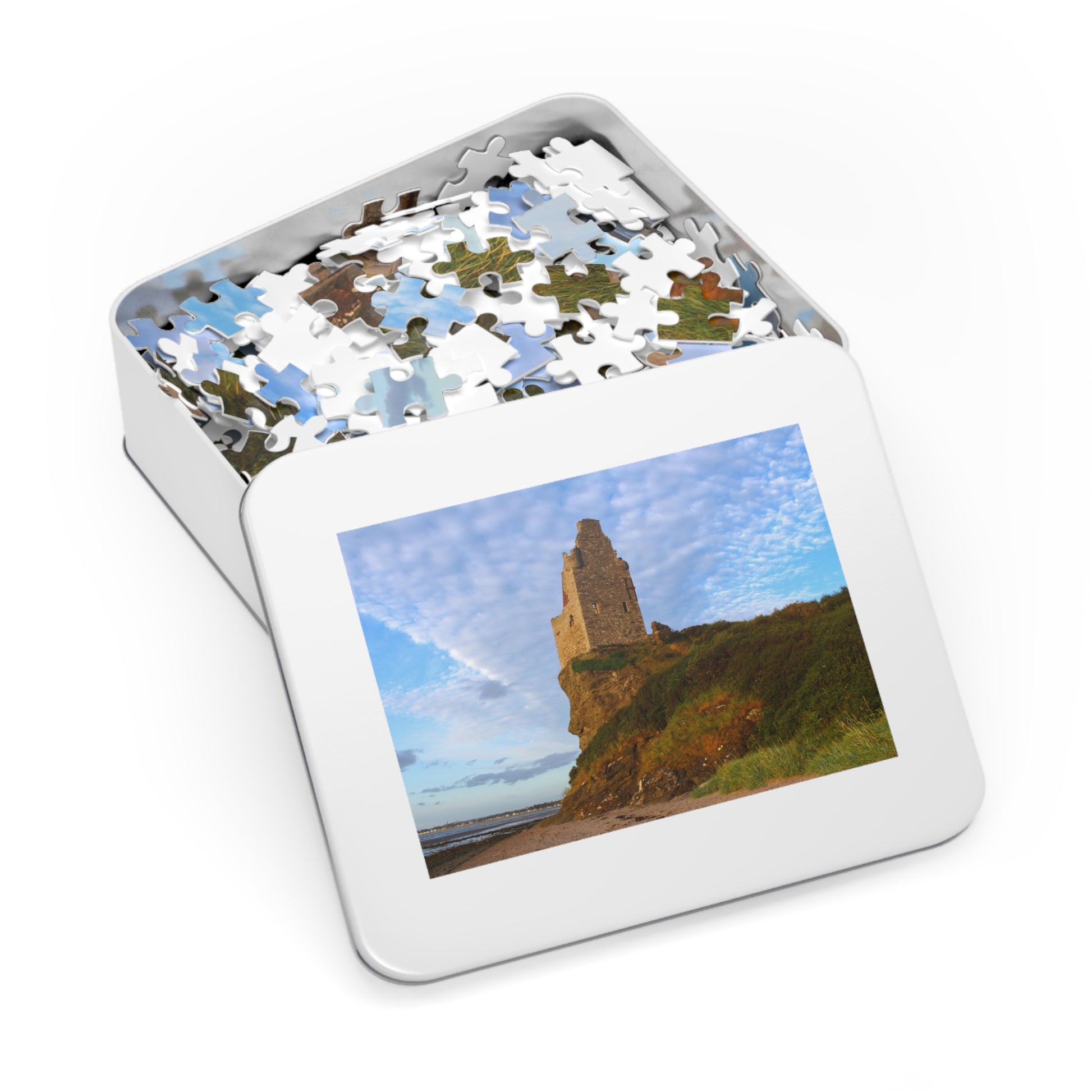 Jigsaw puzzle in a tin with a scenic image on the cover