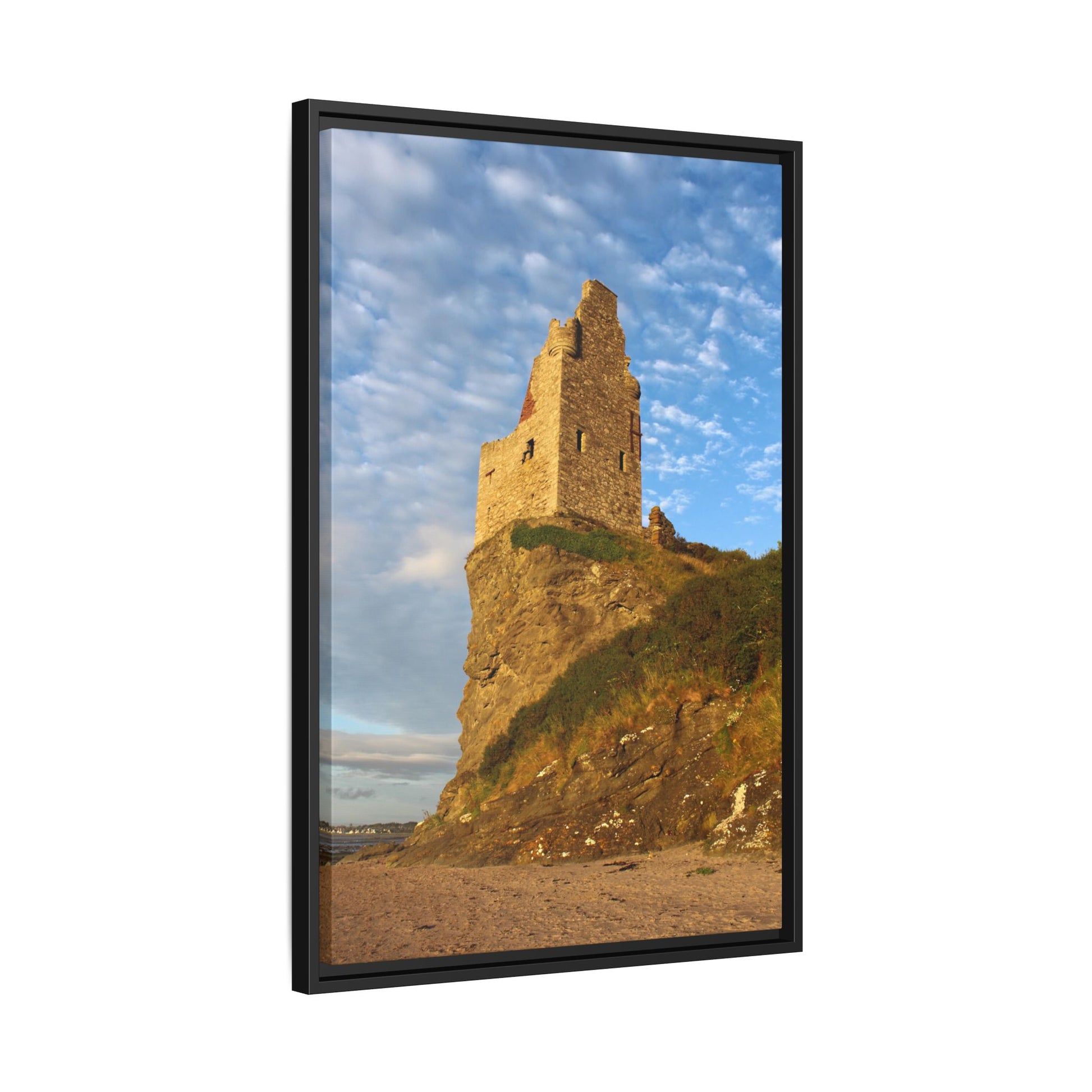Framed picture of a castle ruin on a hill with a blue sky.