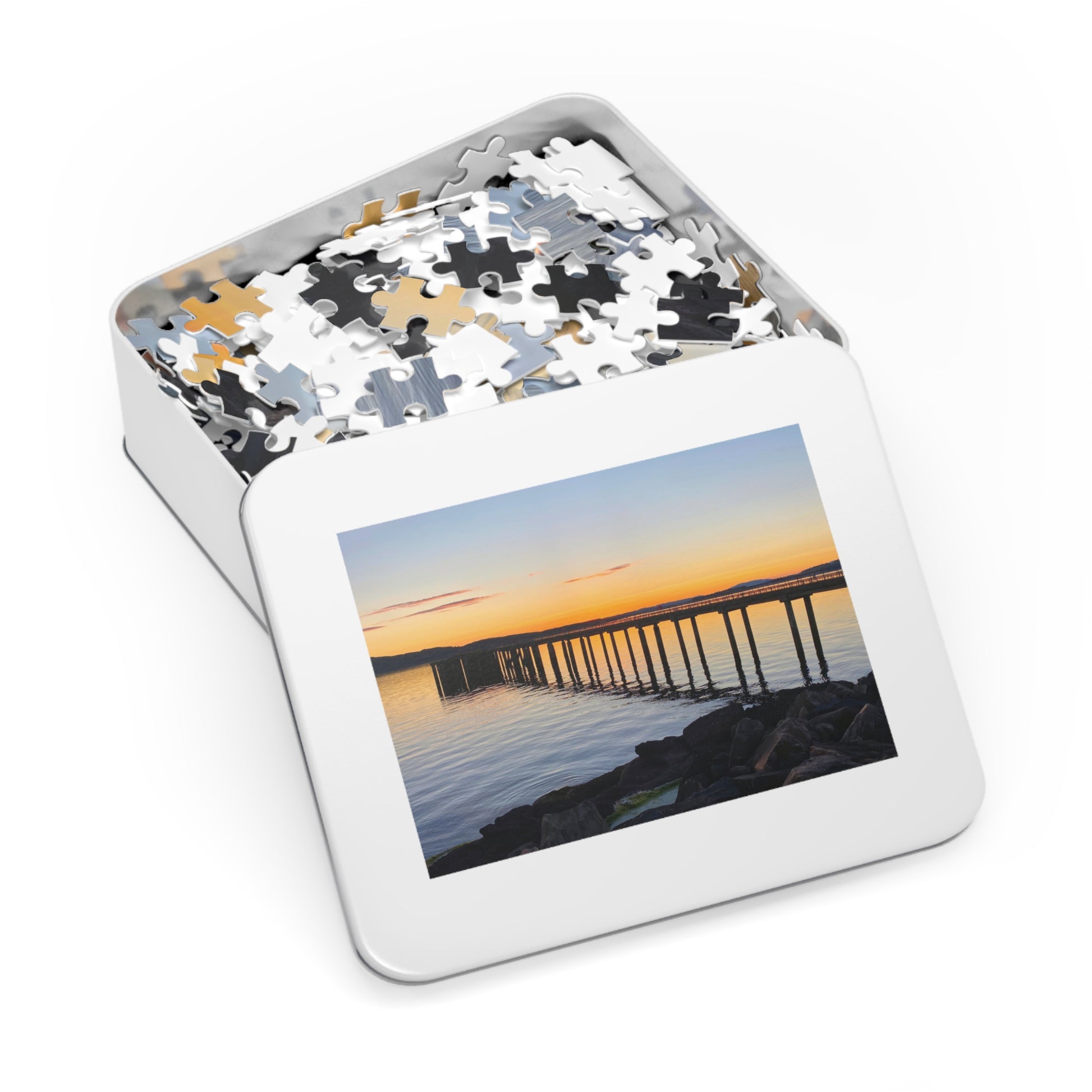 Jigsaw puzzle in a tin with a scenic cover