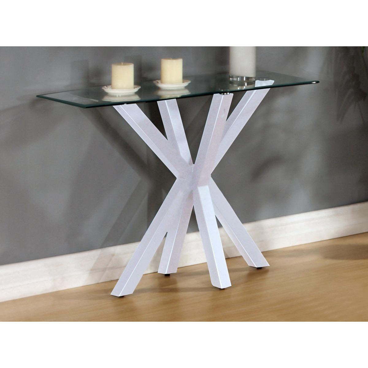 A white high gloss console table with a glass top, featuring a simplistic and modern design, with a small candle-like light on top.