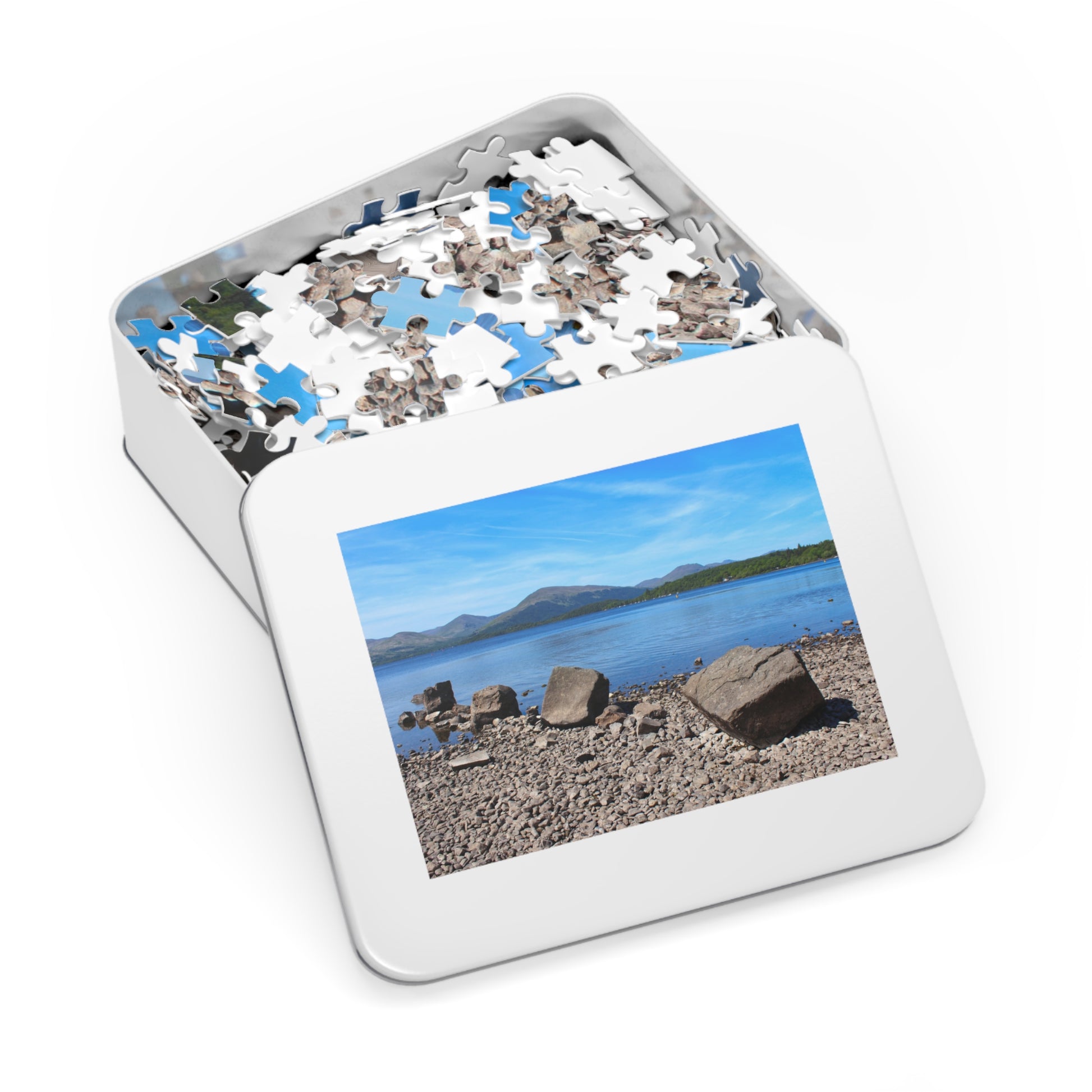 Jigsaw puzzle in a box with a scenic picture on the lid