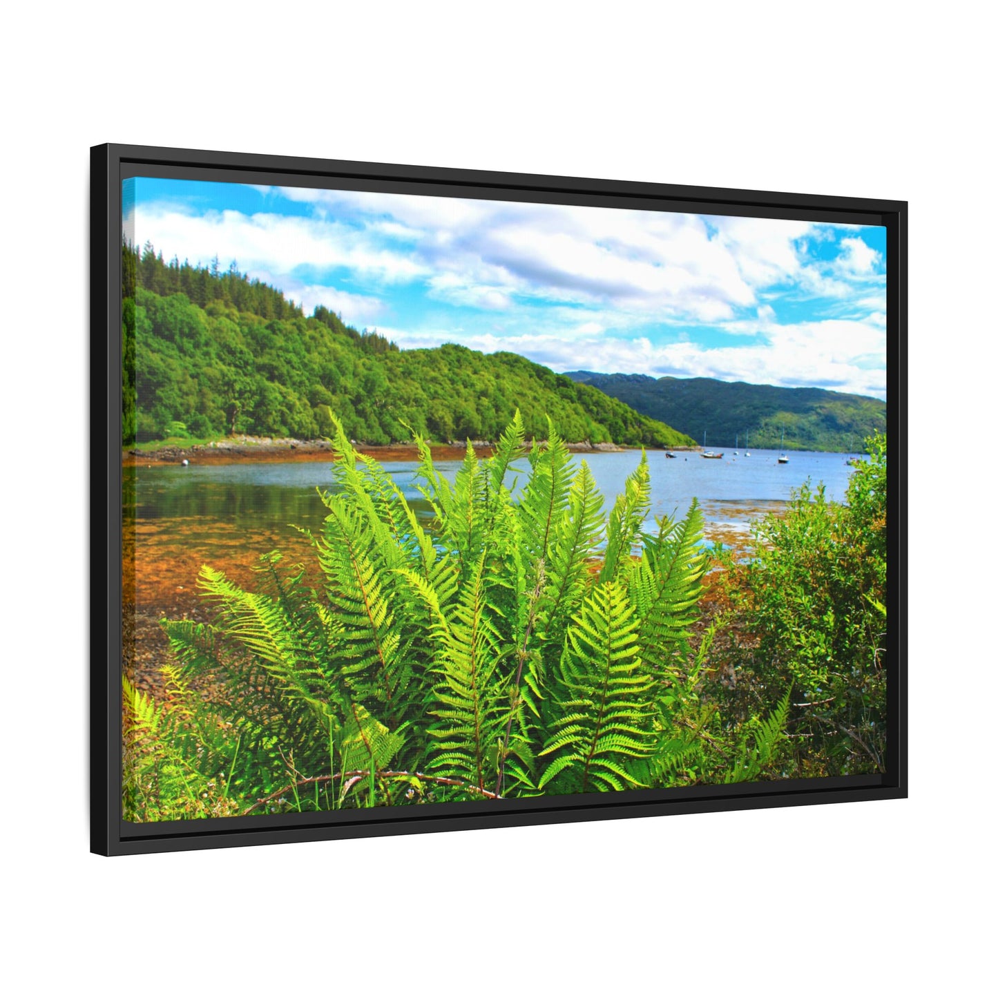 Framed picture of a scenic landscape with a lake and mountains.