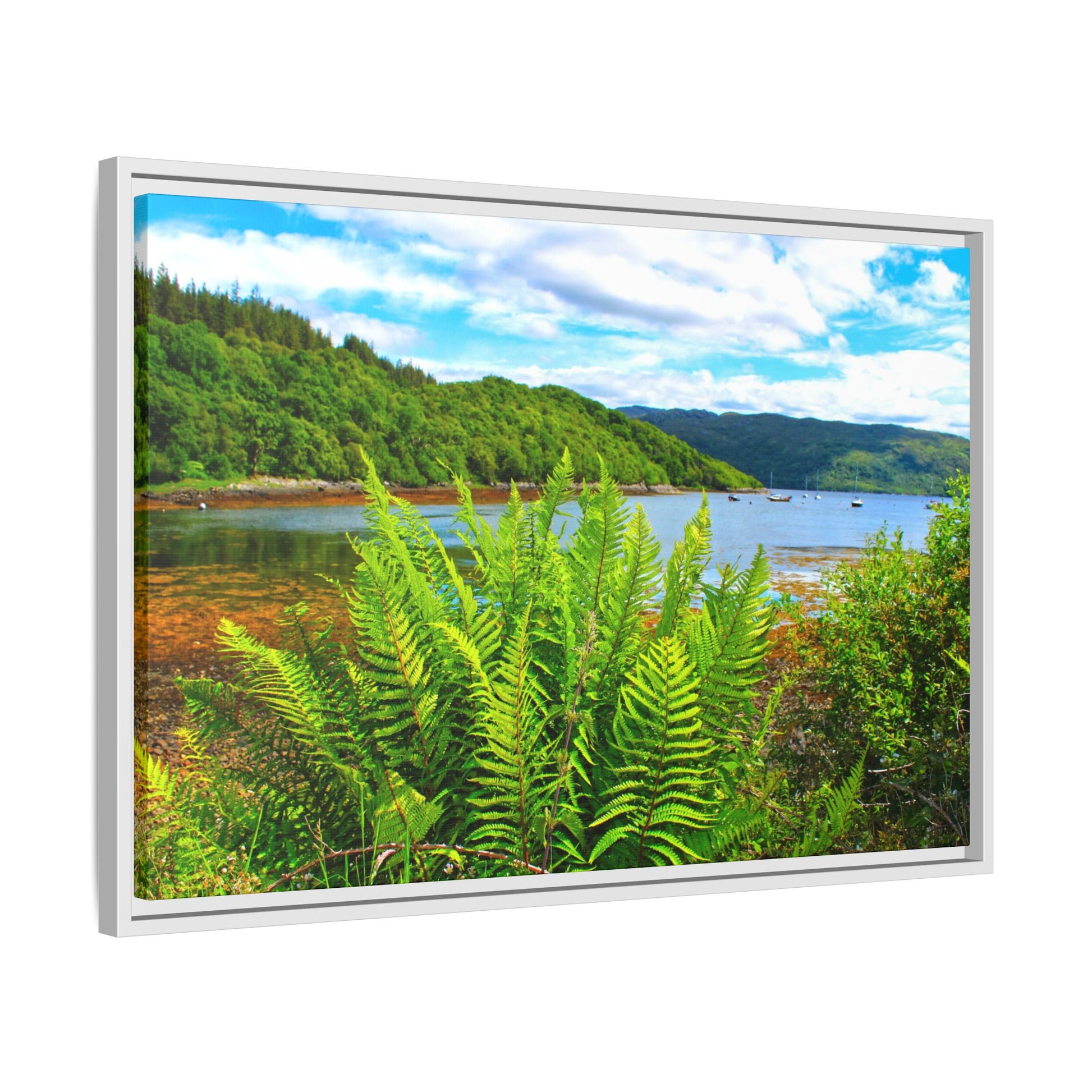 Framed picture of a scenic landscape with a lake and mountains.