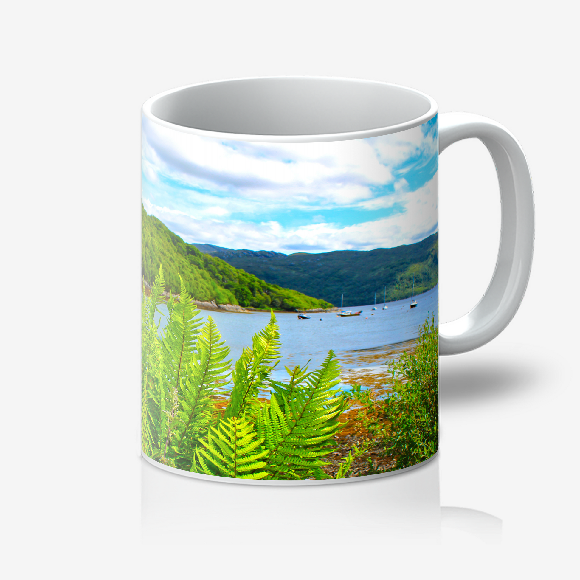 Mug with a scenic design of a lake and mountains on a white background
