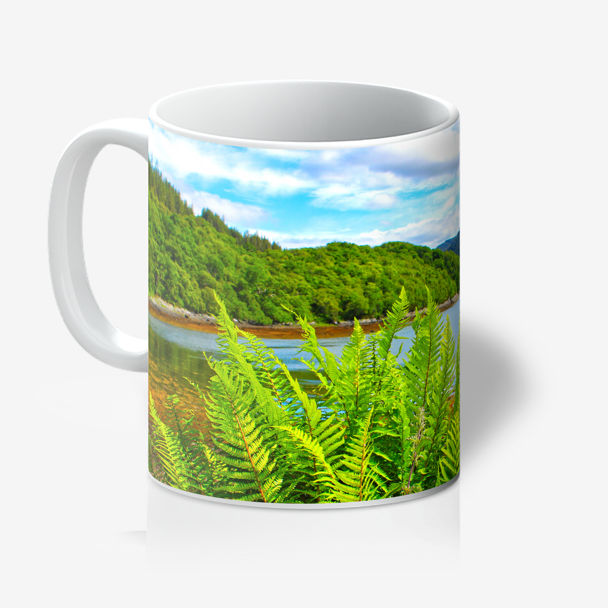 Mug with a scenic design of a lake and greenery on a white background