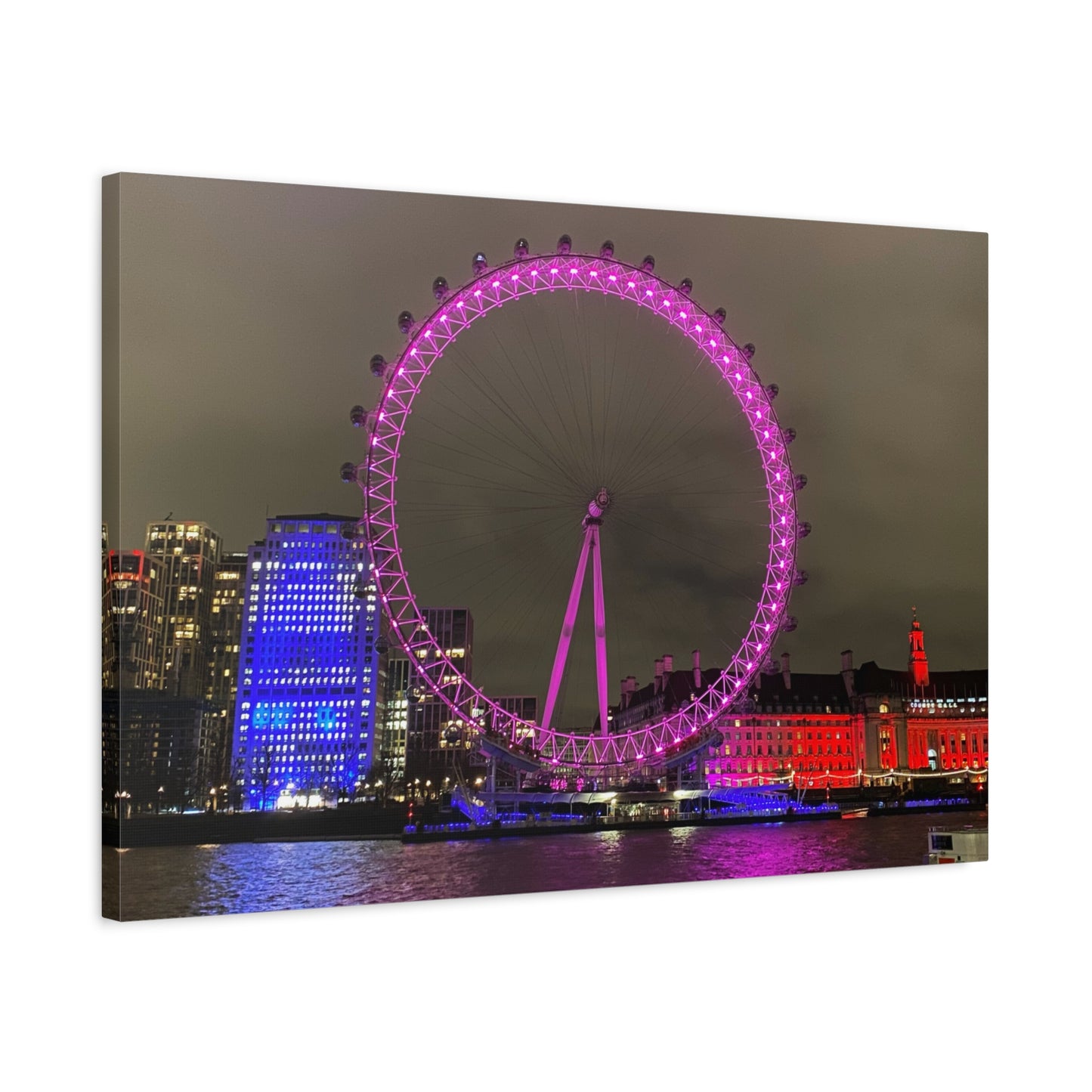 Framed artwork of the London Eye at night with colorful illumination.