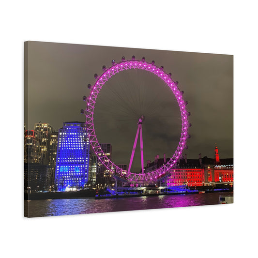 Framed artwork of the London Eye at night with colorful illumination.