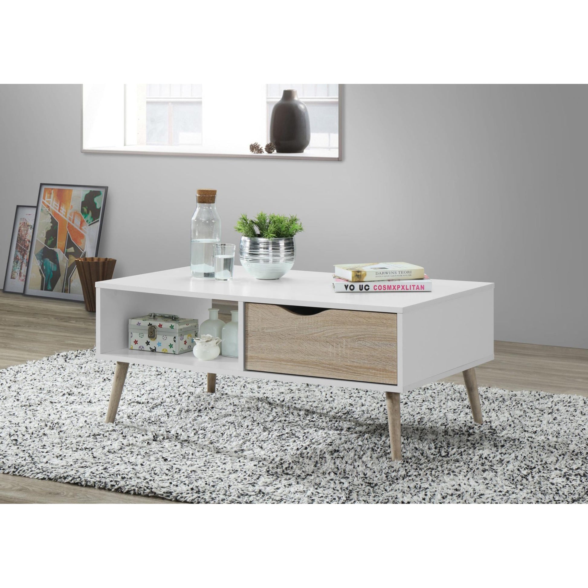 White coffee table with wooden legs in a living room setting