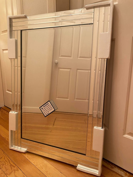 Silver bevelled edge wall mirror.