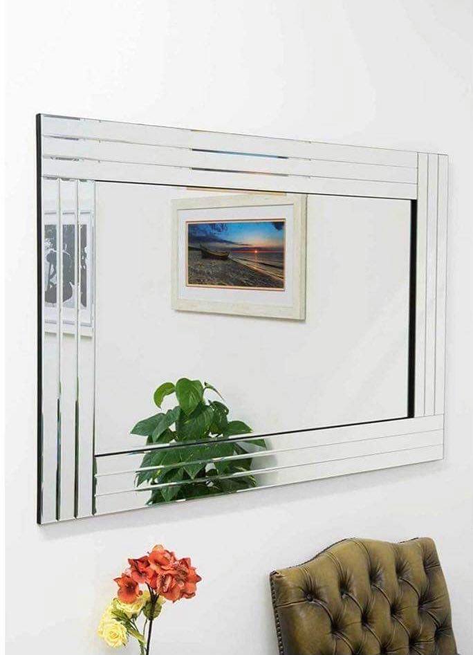 Silver bevelled edge wall mirror.