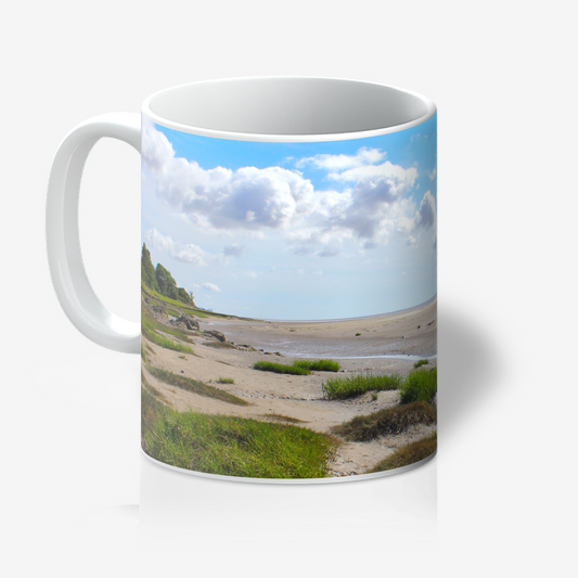Mug with a scenic landscape of a beach and sky printed on it