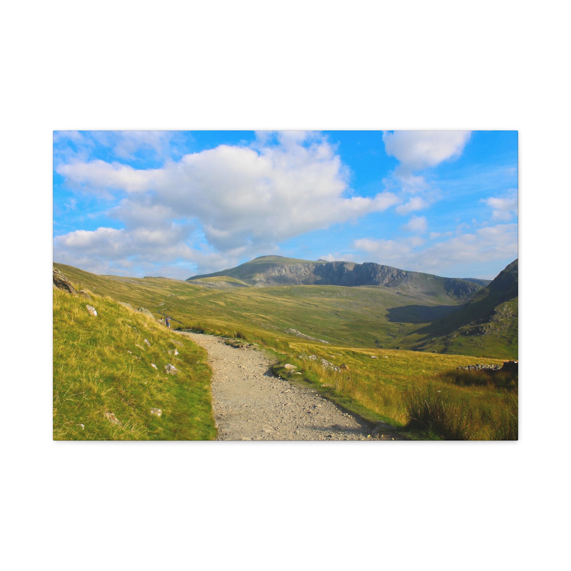 Scenic view of a mountainous landscape with a clear blue sky.