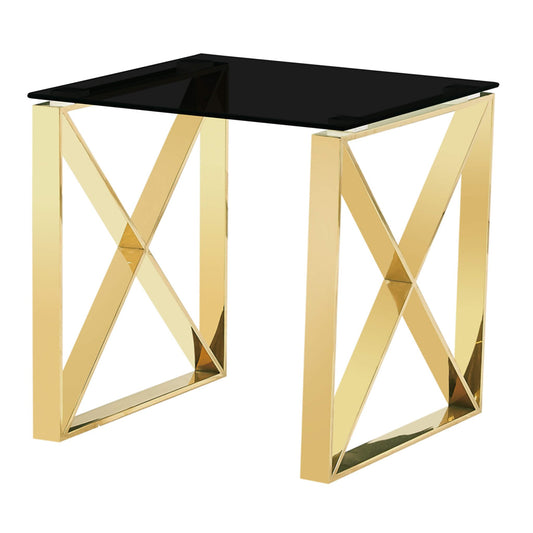Gold side table with black glass top on a white background