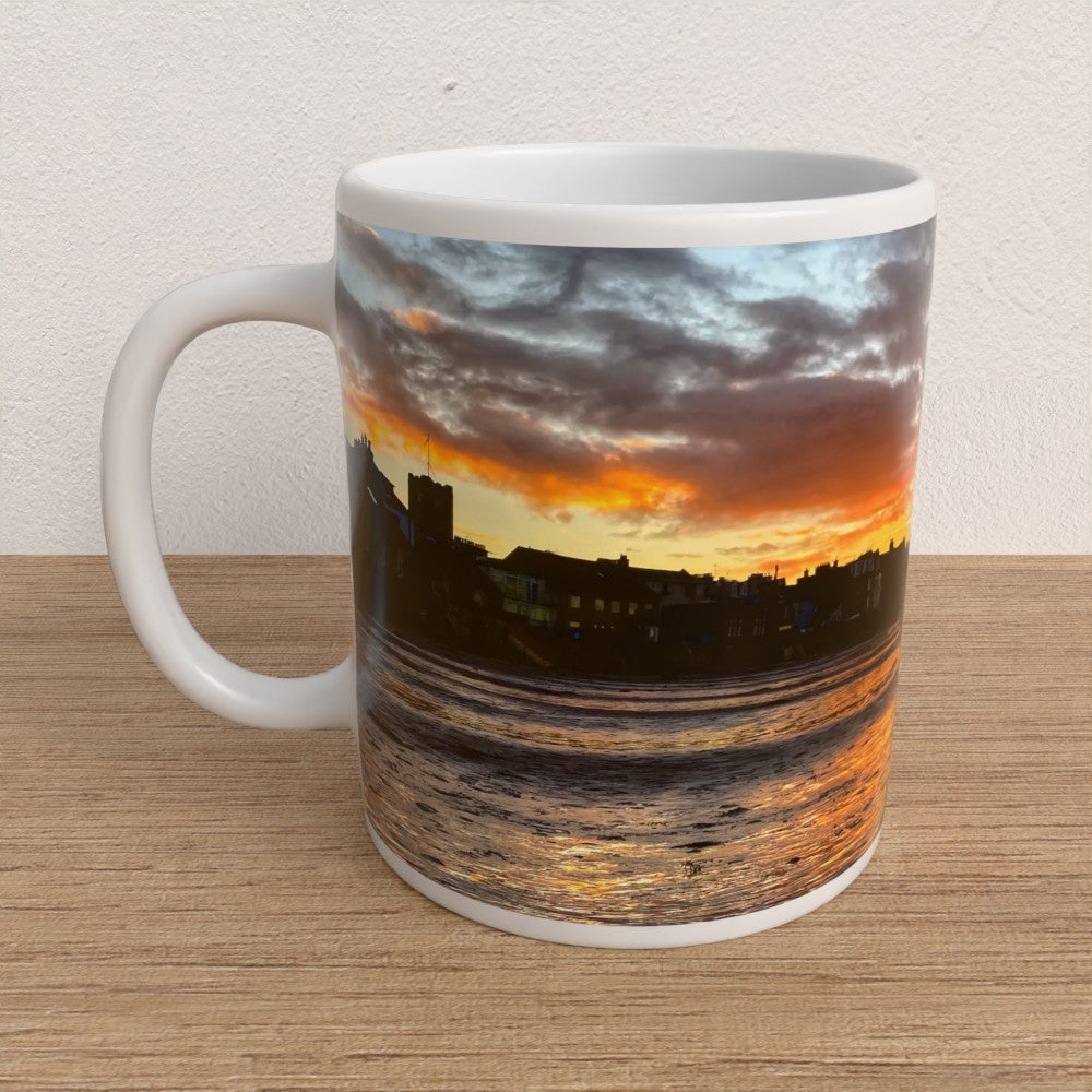 Mug with a sunset design on a wooden surface