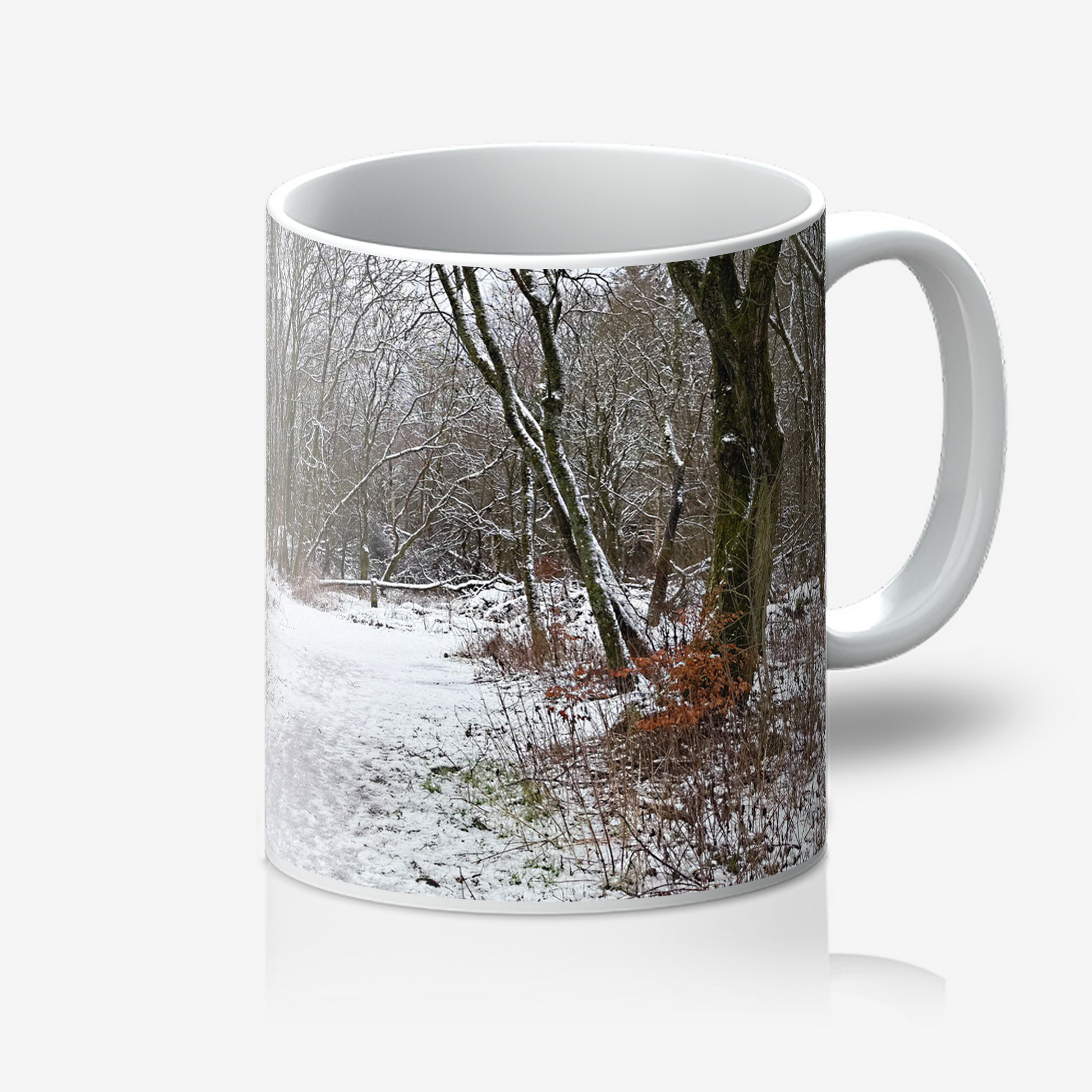 Mug with a winter forest design on a white background