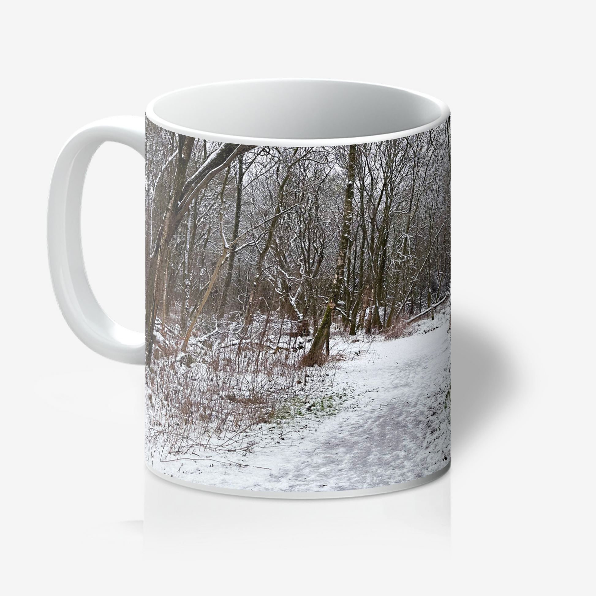 Mug with a winter forest design on a white background