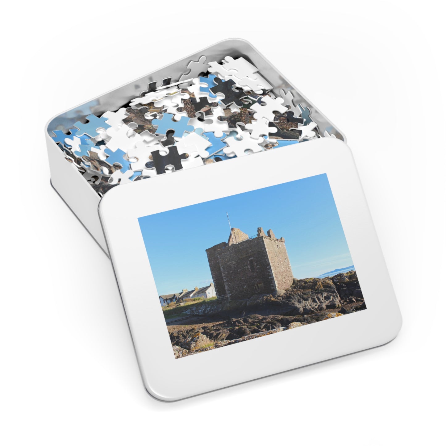 Jigsaw puzzle in a tin with a picture of a castle on the lid