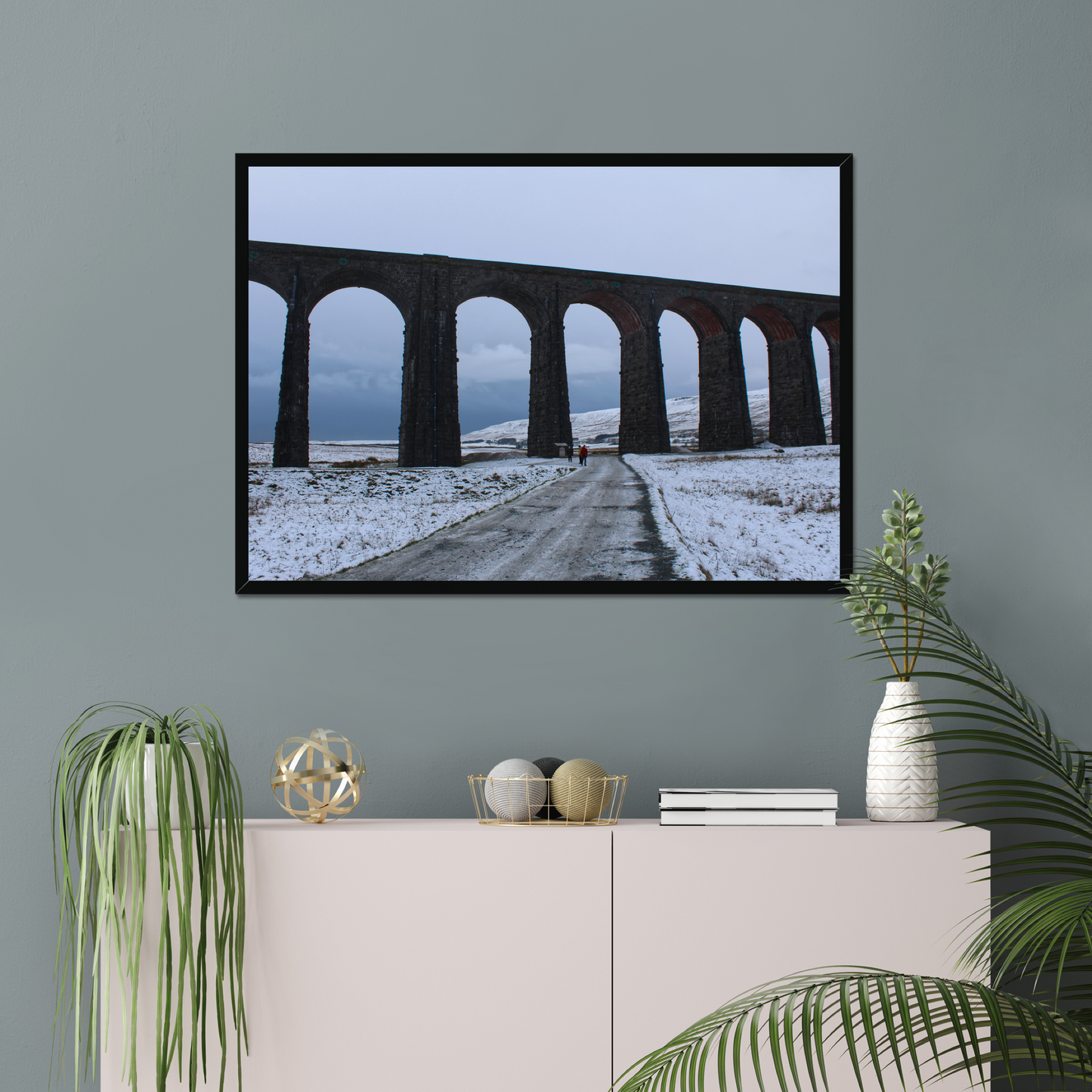 Framed photograph featuring the Ribblehead Viaduct in winter with snow on the ground and a cloudy sky.