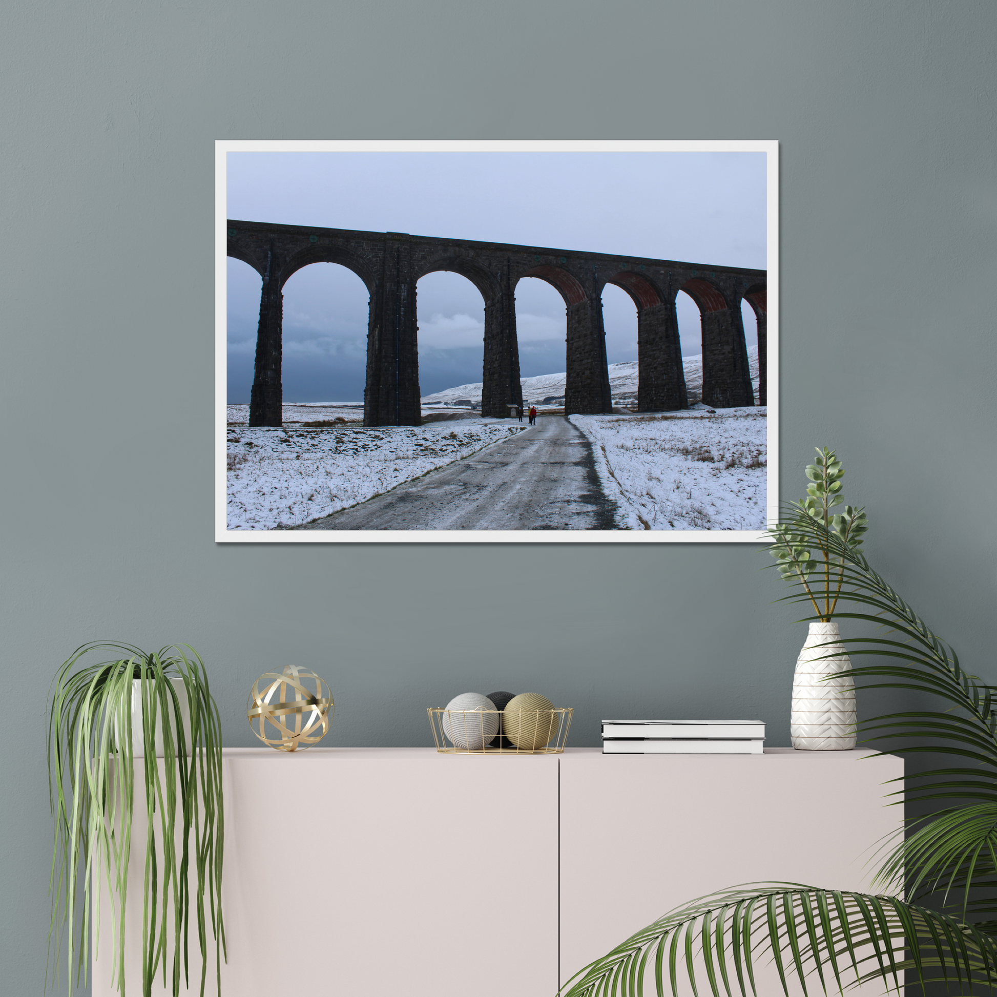 Framed photograph featuring the Ribblehead Viaduct in winter with snow on the ground and a cloudy sky.