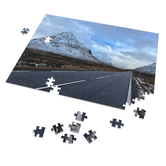 Jigsaw puzzle with a scenic road and mountain landscape