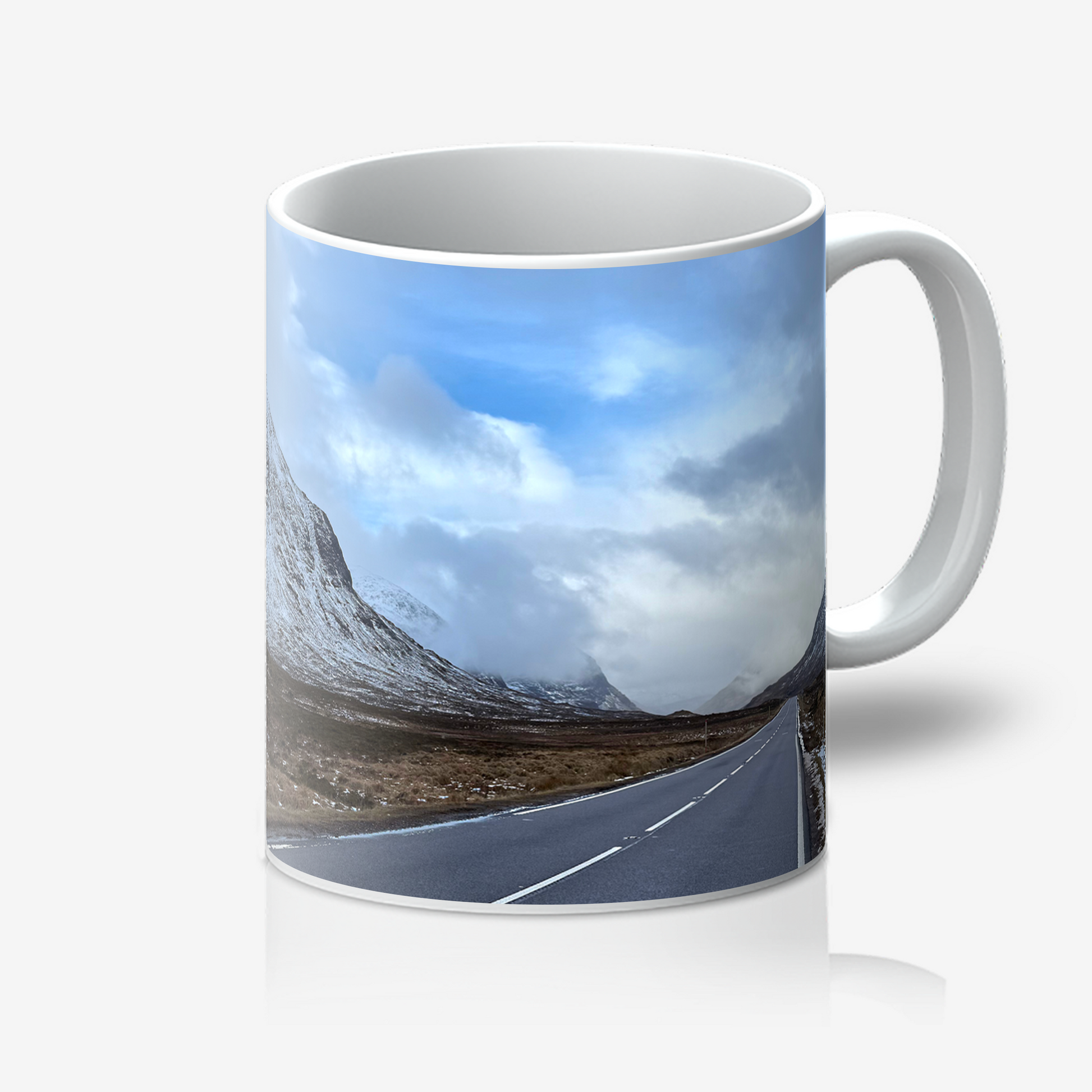 Mug with a scenic design of a road and mountains on a white background