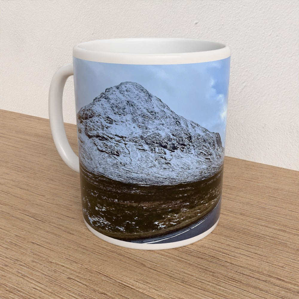 Mug with a mountain design on a wooden surface