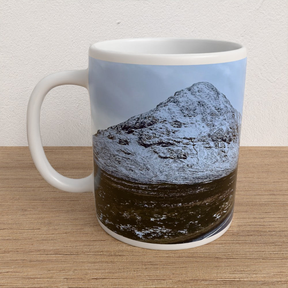 Mug with a mountain design on a wooden surface