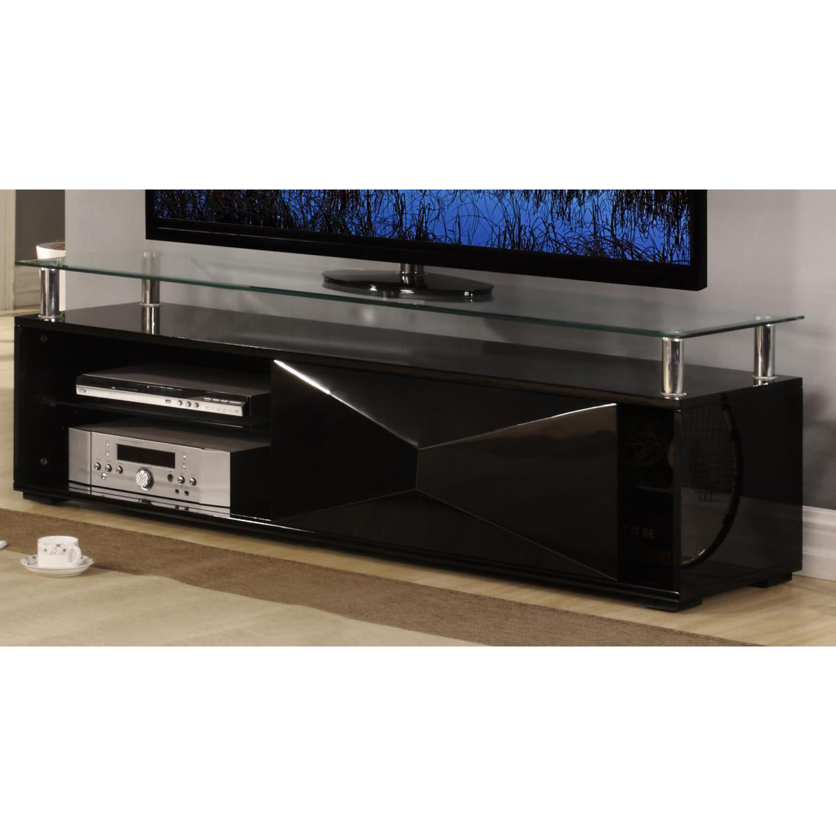 A black high gloss TV unit with a flat-screen TV on top and various media devices on the shelves below, placed in a living room setting.
