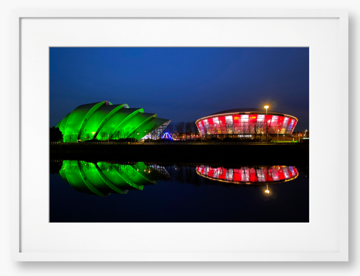 Framed Photo featuring the Glasgow SEC Armadillo and Hydro buildings lit up at night, reflected in the water of the Clyde.