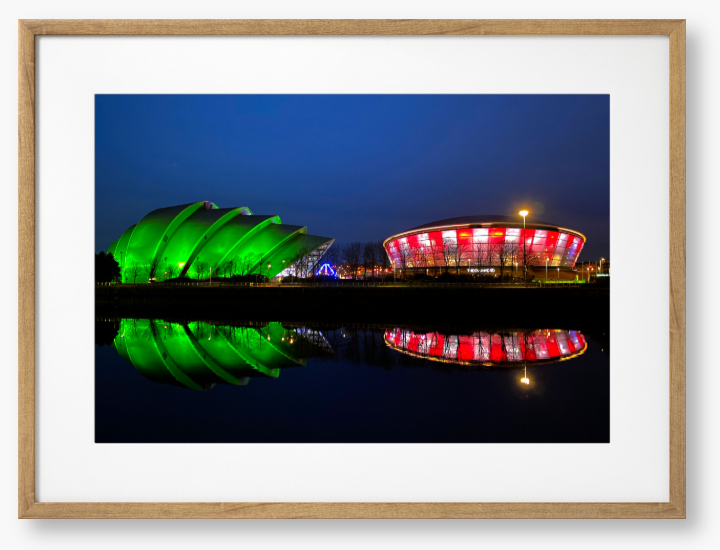 Framed Photo featuring the Glasgow SEC Armadillo and Hydro buildings lit up at night, reflected in the water of the Clyde.