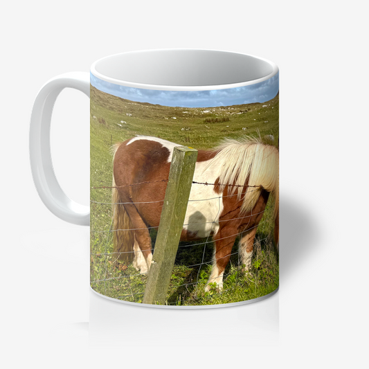 Mug with a horse in a field design on a white background