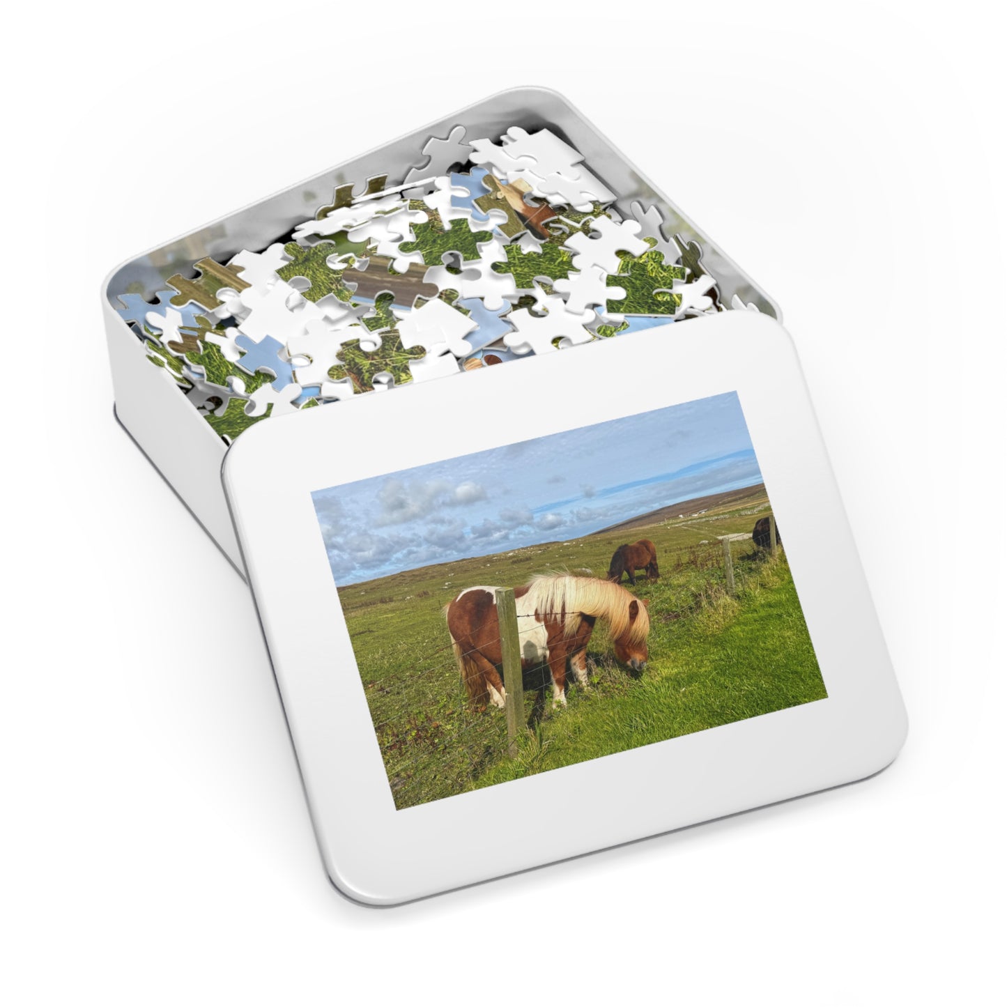 Jigsaw puzzle with horses in a field on a white background