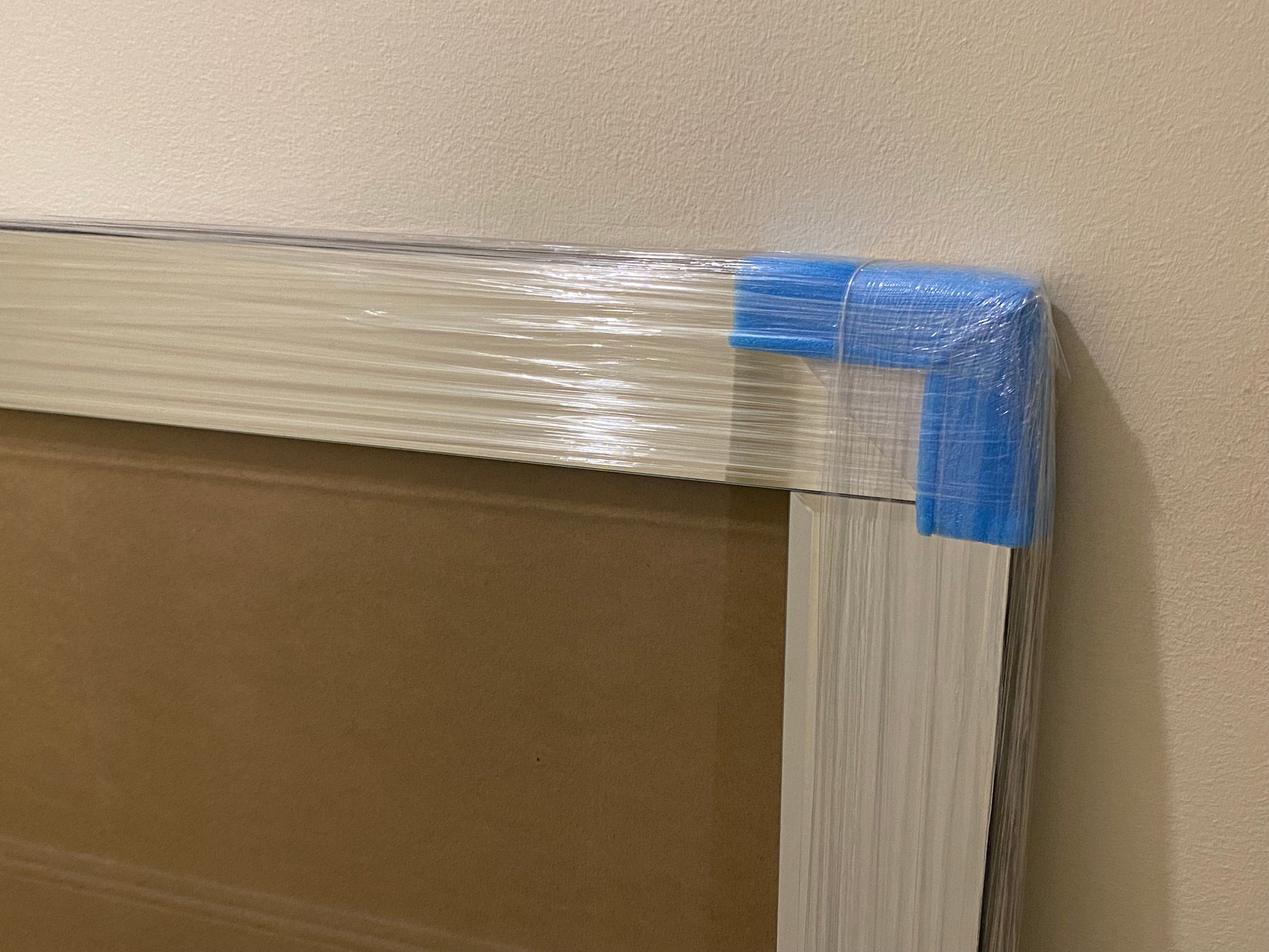 Corner of a mirrored picture frame