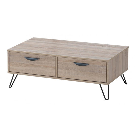 Wooden coffee table with two drawers and metal legs on a white background