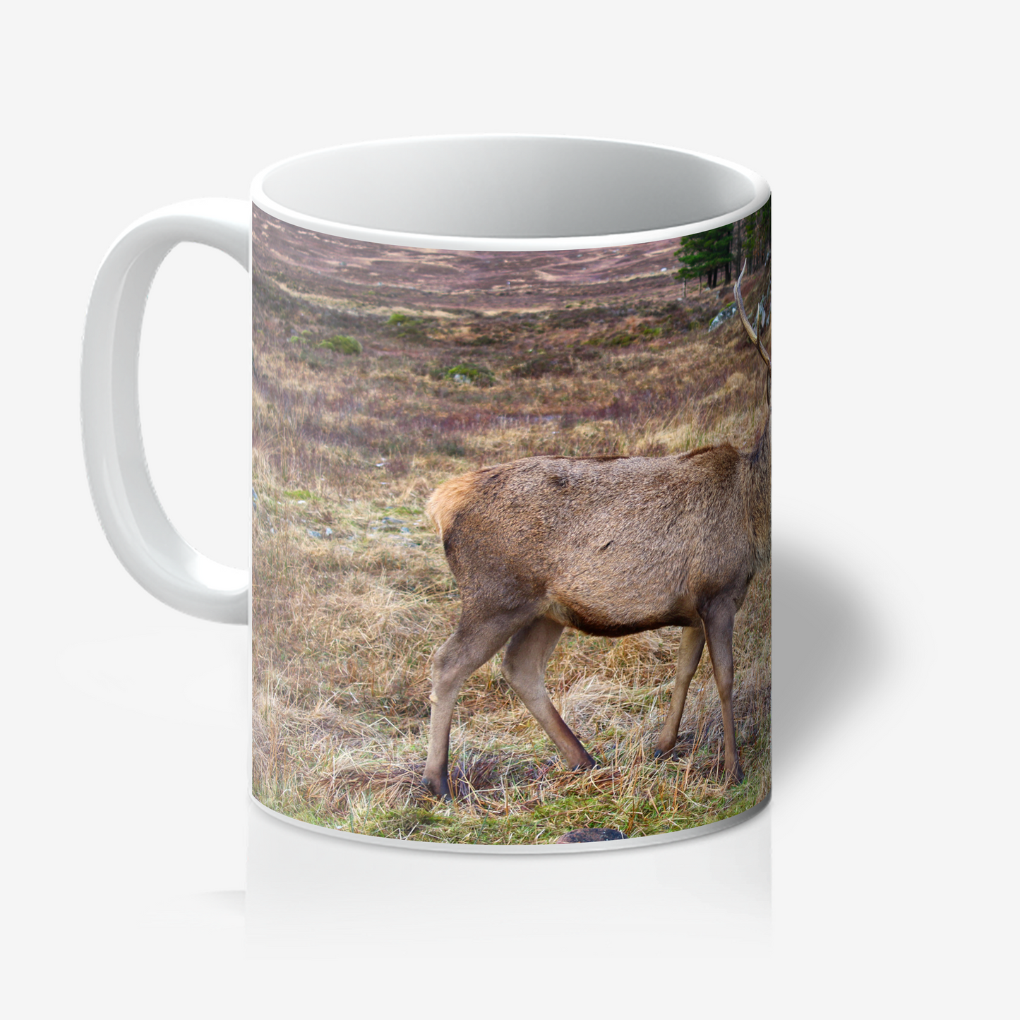 Mug with a deer in a field design on a white background