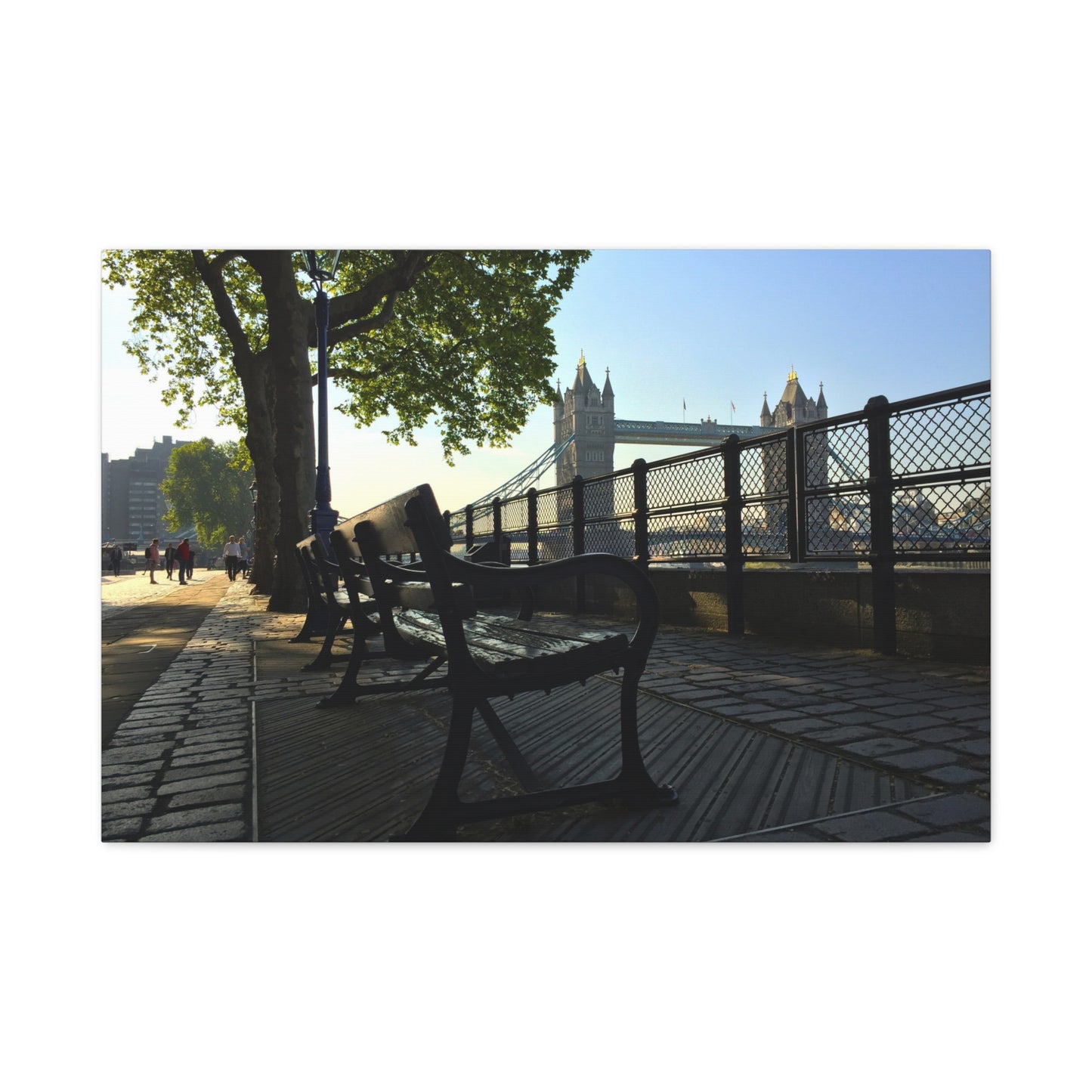 Bench under a tree with Tower Bridge in the background