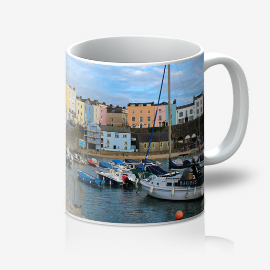 Mug with a scenic design of a harbour and colourful buildings.
